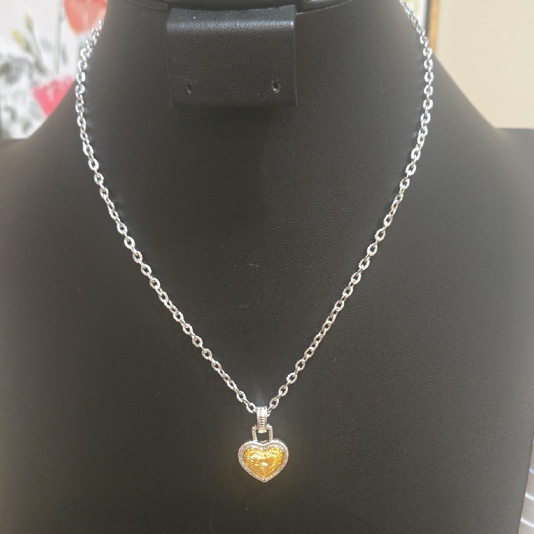 Elegant Silver Necklace With Gold Heart Pendant